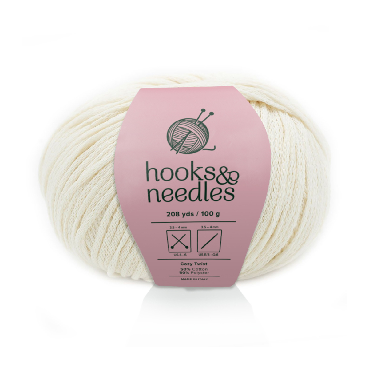 A skein of Cozy Twist Yarn in off-white features 208 yards, 100 grams, and a blend of 85% cotton and 15% acrylic on a pink "hooks & needles" band—ideal for soft, durable, and versatile projects.
