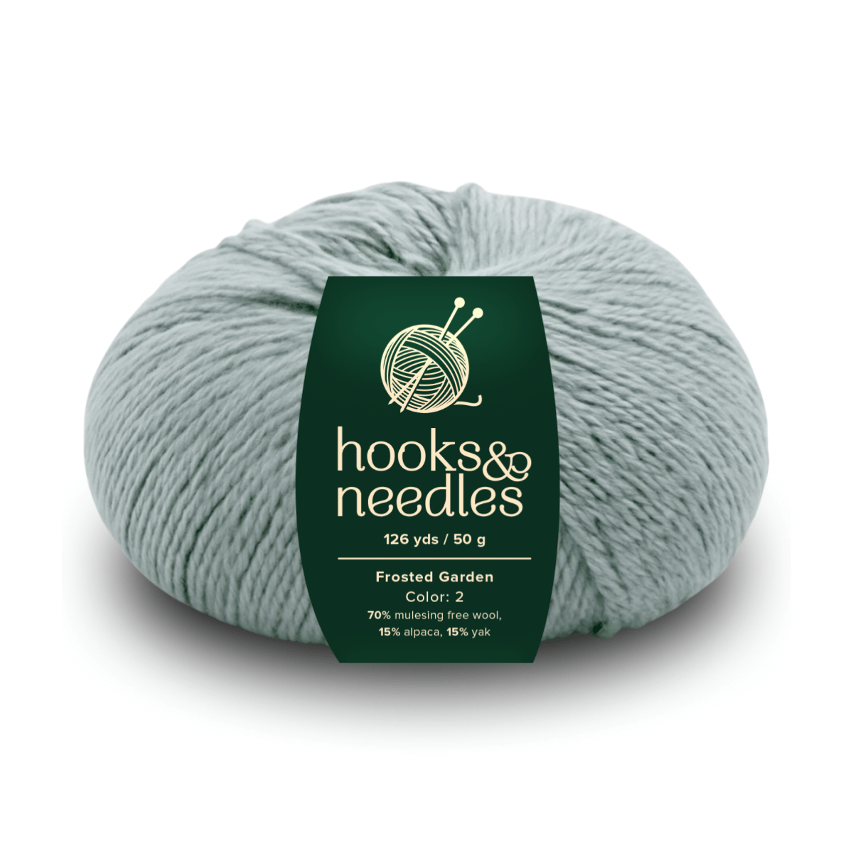 A skein of "Frosted Garden" yarn—luxurious and ethical, with 70% mulesing-free wool, 15% alpaca, 15% yak; 126 yds/50g in pale green.