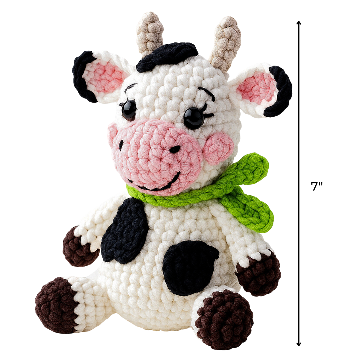 Hazel The Cow Crochet Pattern: Create a plush amigurumi cow with a green scarf, pink snout, and black spots. Sitting upright at 7 inches tall, it's perfect for beginner crocheters.