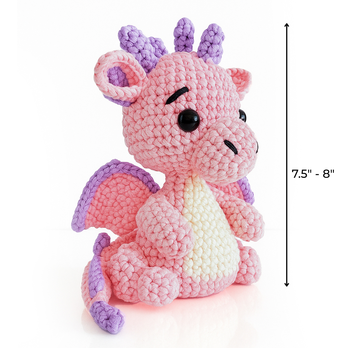 Sparkle The Dragon Crochet Pattern lets you create a pink and purple amigurumi dragon plush, about 7.5–8 inches tall, with black eyes—a charming project for anyone who loves unique crochet dragon designs.