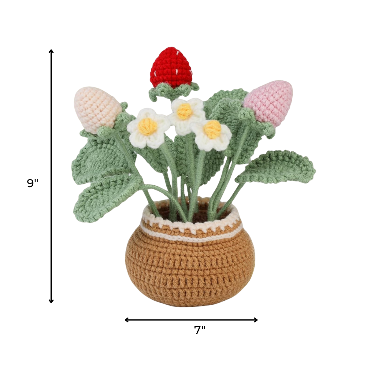The Crochet Strawberry Plant Kit comes with everything to craft a 9" tall, 7" wide plant in a brown pot with red and pink strawberries, white flowers, and green leaves. Ideal for beginners or as a charming crochet gift.