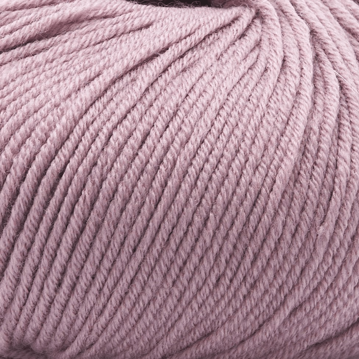Close-up of a ball of light purple Vintage Garden yarn, featuring smooth, tightly wound strands and luxurious softness.