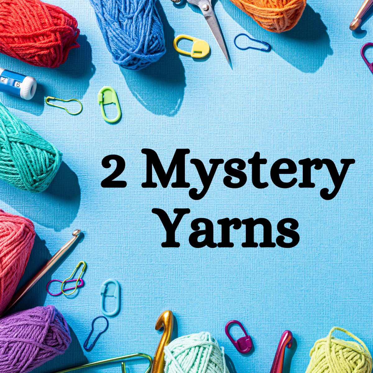 Colorful yarn balls, crochet hooks, and paper clips are artfully arranged on a blue background. In the center, text reads, "Extra 2 Mystery Balls of Yarn," offering an intriguing monthly add-on for those seeking extra yarn adventures.