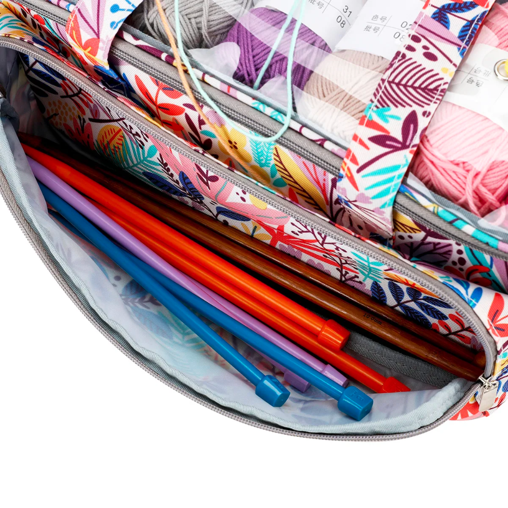 The Crochet Knitting Bag Organizer (Bundle8), adorned with a floral pattern and filled with colorful knitting needles and vibrant yarn, is the perfect companion for your crafting supplies, keeping all your knitting accessories organized in style.