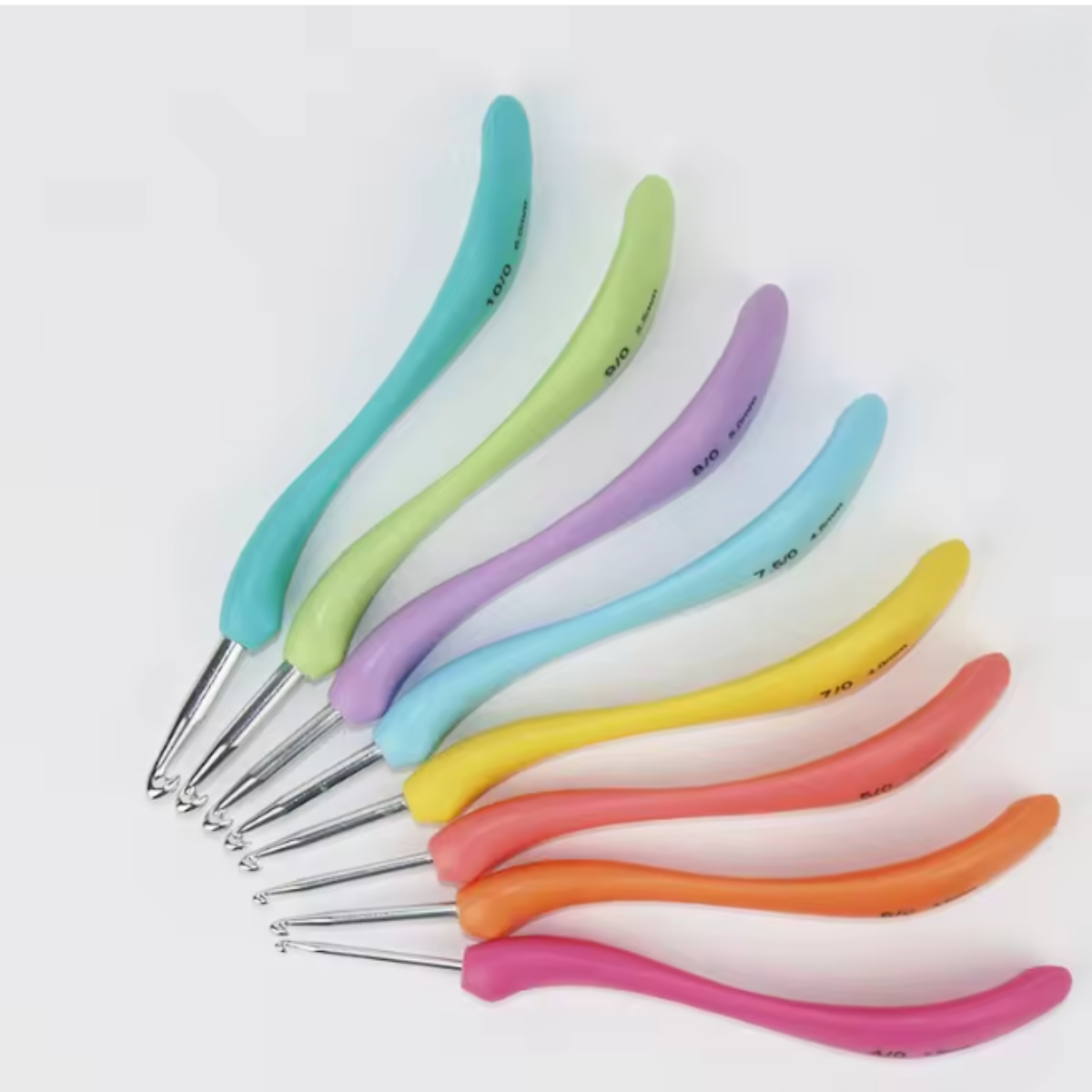 Eight ergonomic crochet hooks from the Crochet Hook Set 8 Pcs with soft grip, multicolored handles are arranged in a fan shape on a white background.