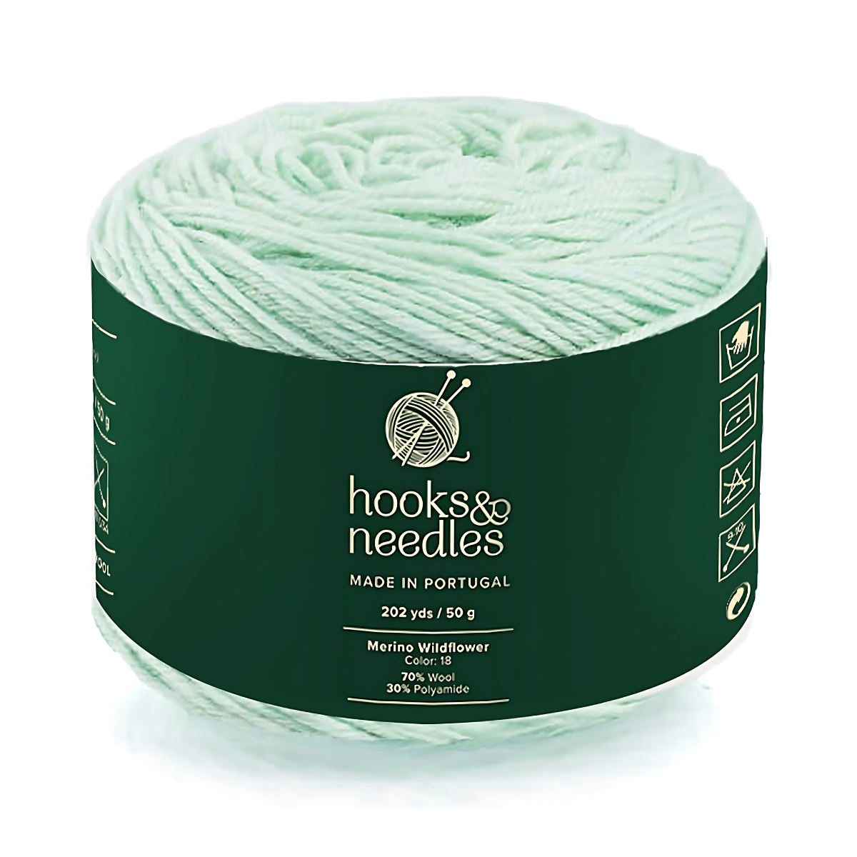 A 50g ball of Merino Wildflower Yarn—pale green, made in Portugal, 202 yards, and crafted with 70% Merino wool and 30% polyamide for warmth.