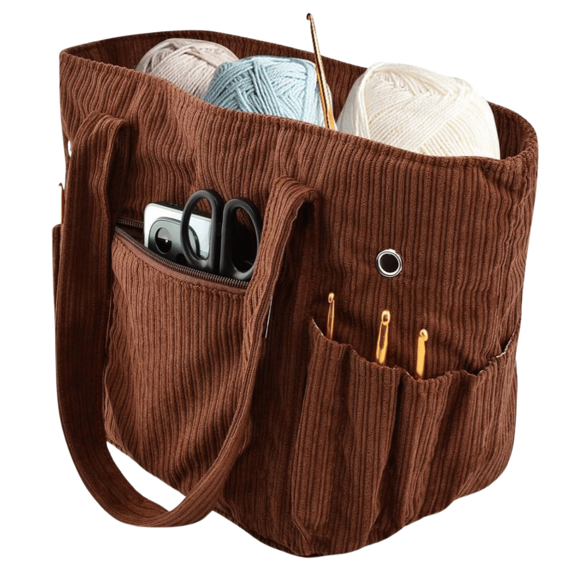The Crochet & Knitting Organizer Tote in brown fabric features multiple exterior pockets to hold yarn, crochet hooks, scissors, a tape measure, your phone, and even fits a flame ceramic yarn bowl for tangle-free crafting.