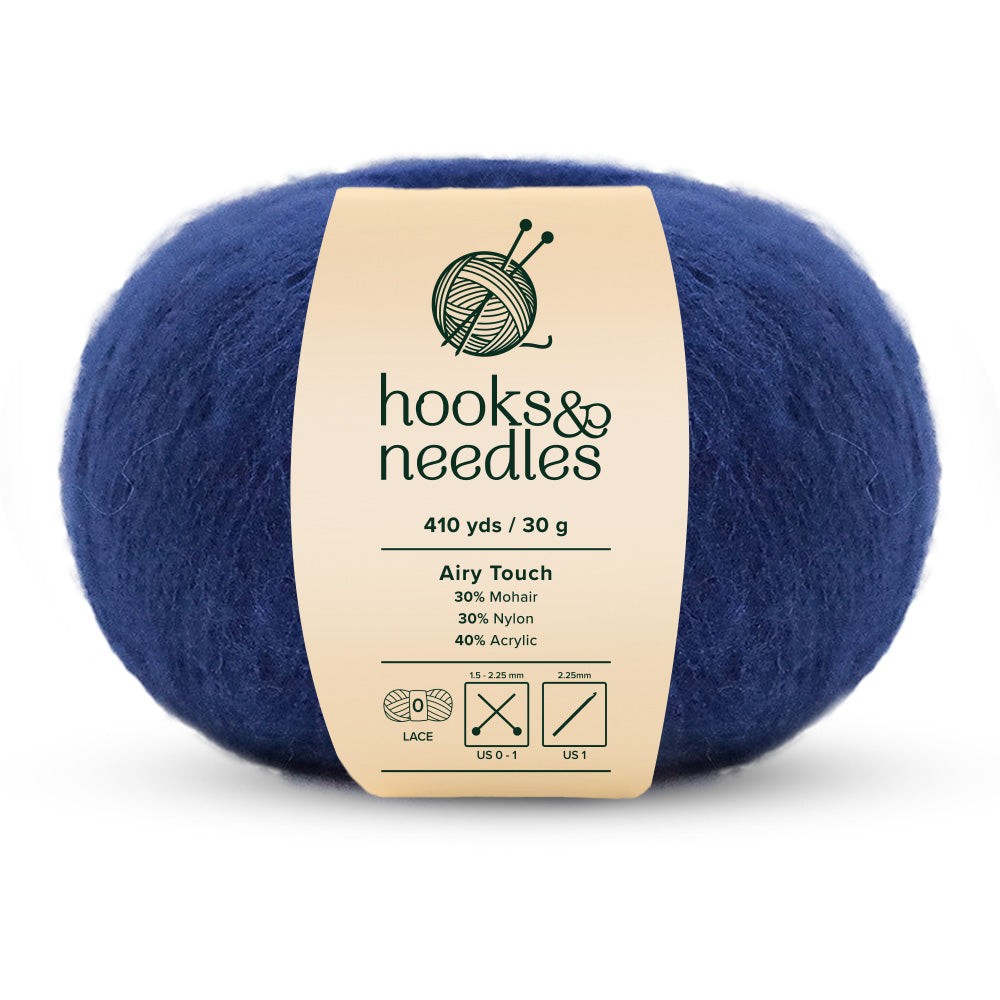 The Airy Touch Yarn 30g is a ball of blue yarn featuring 410 yards of lace-weight fibers made from 30% mohair, 30% nylon, and 40% acrylic, making it perfect for creating delicate accessories and ethereal garments.
