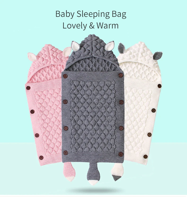 Experience the cozy comfort of our Knitted Baby Sleeping Bag Wrap Blanket bundle, adorned with charming designs that include hoods and animal ears available in pink, gray, and white against a pale blue background.