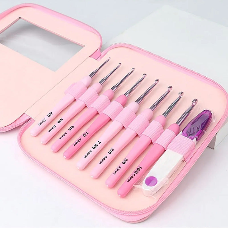 The Ergonomic Crochet Hook Set 9 Pcs with Case features varying sizes of hooks with pink handles, designed for pain-free crocheting, and comes neatly stored in a matching pink zippered case.