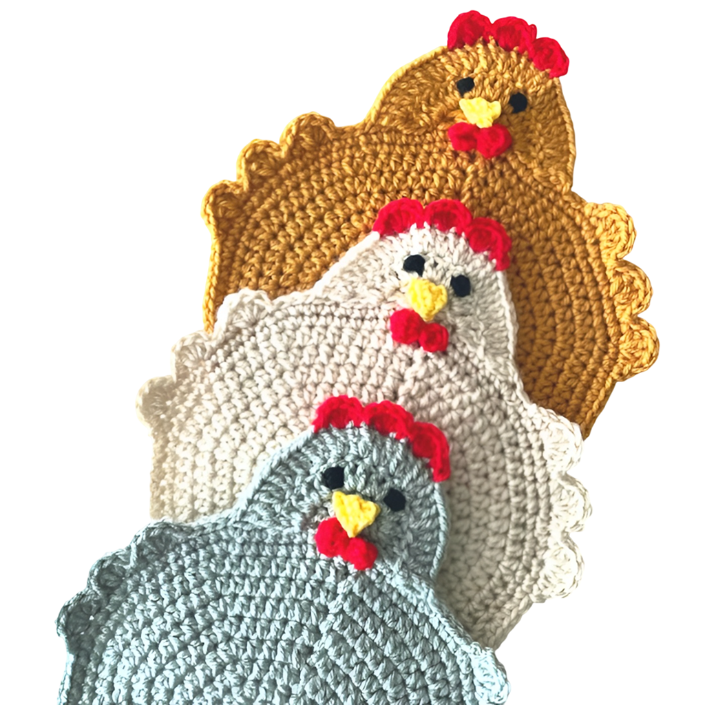 Three crocheted chicken-shaped pot holders in yellow, white, and gray—with red combs and yellow beaks—are shown on a white background. Create these unique coasters at home with the DIY Chicken Coaster Crochet Kit.
