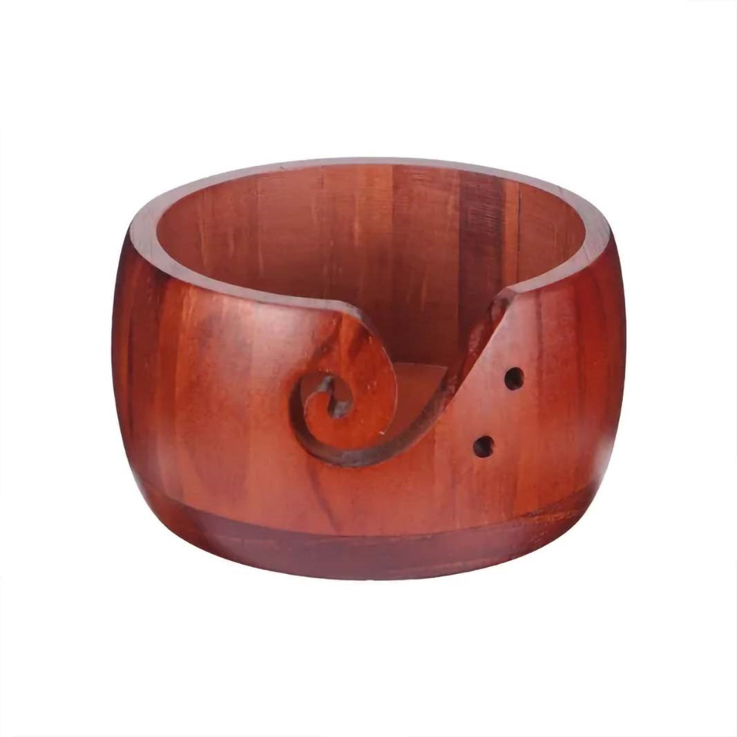 The Handmade Wooden Yarn Bowl boasts a smooth finish and features a carefully shaped cutout on the side designed to gently guide your yarn.