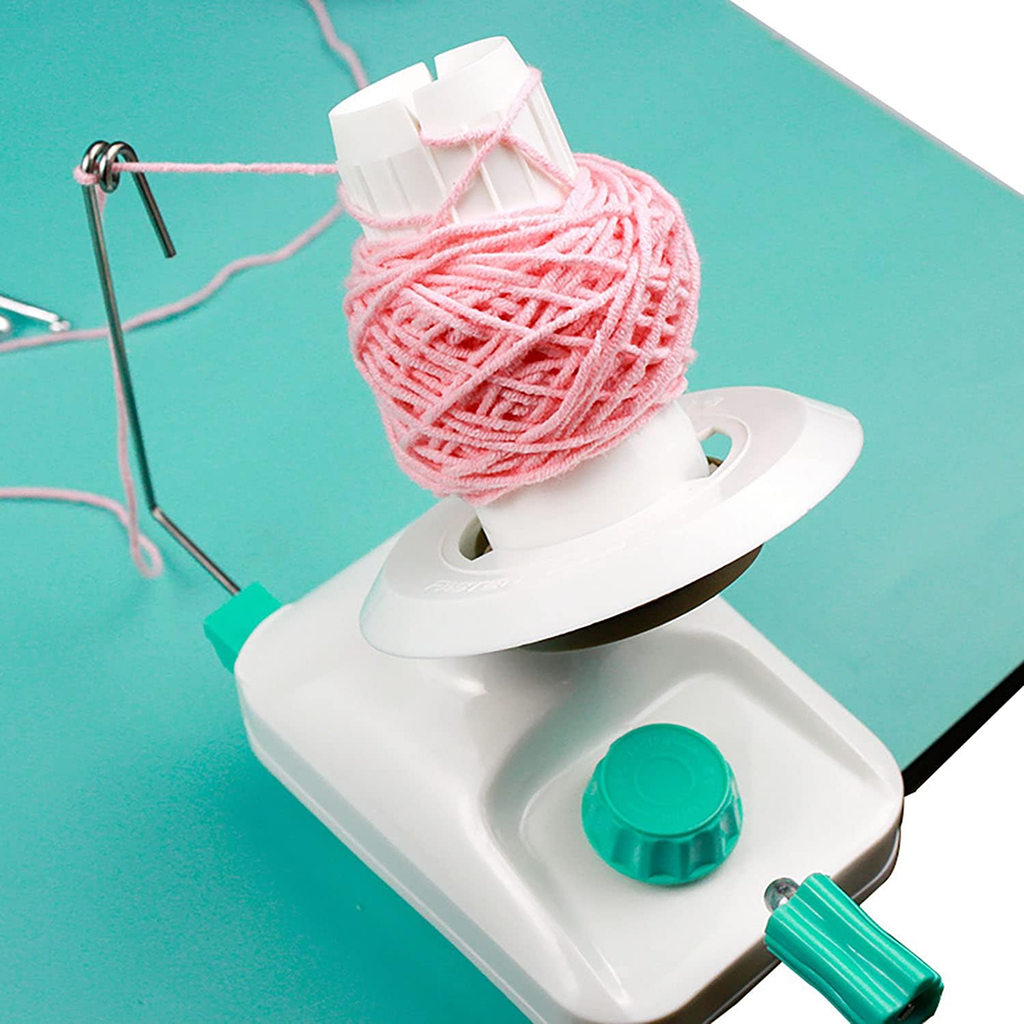 The Yarn Ball Winder, displayed with pink yarn forming a neat ball on a turquoise surface, provides time-saving convenience for crafters.