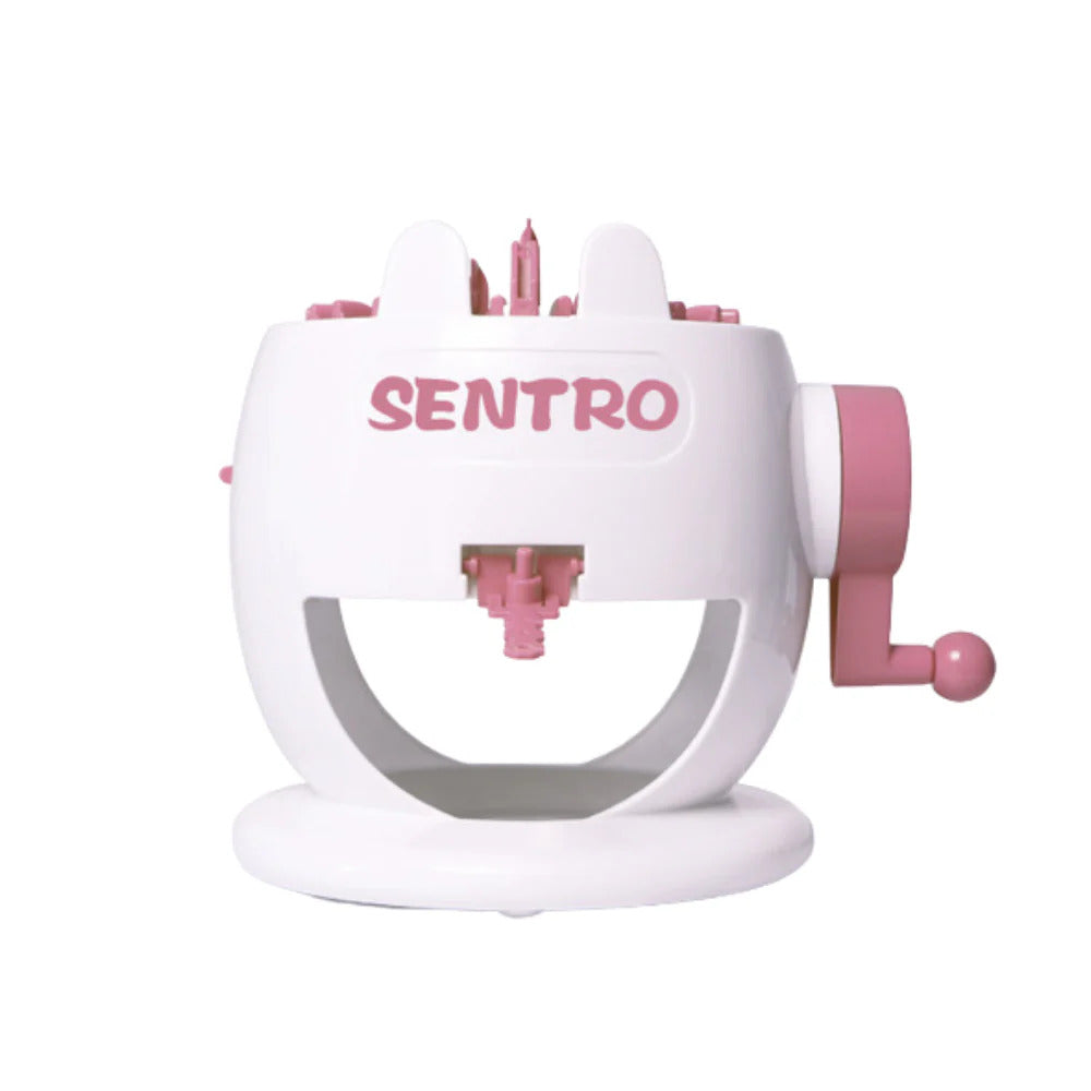 The pink and white Rabbit 22 Needles Knitting Machine Kit features a user-friendly design with a convenient crank handle on the side, making DIY knitting projects enjoyable and accessible.