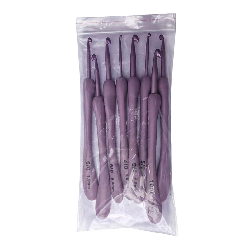 Explore the 8 Pcs Purple Crochet Hook Set, featuring an ergonomic design in various sizes to elevate your crafting experience. It comes neatly packaged in a clear plastic bag for easy organization.
