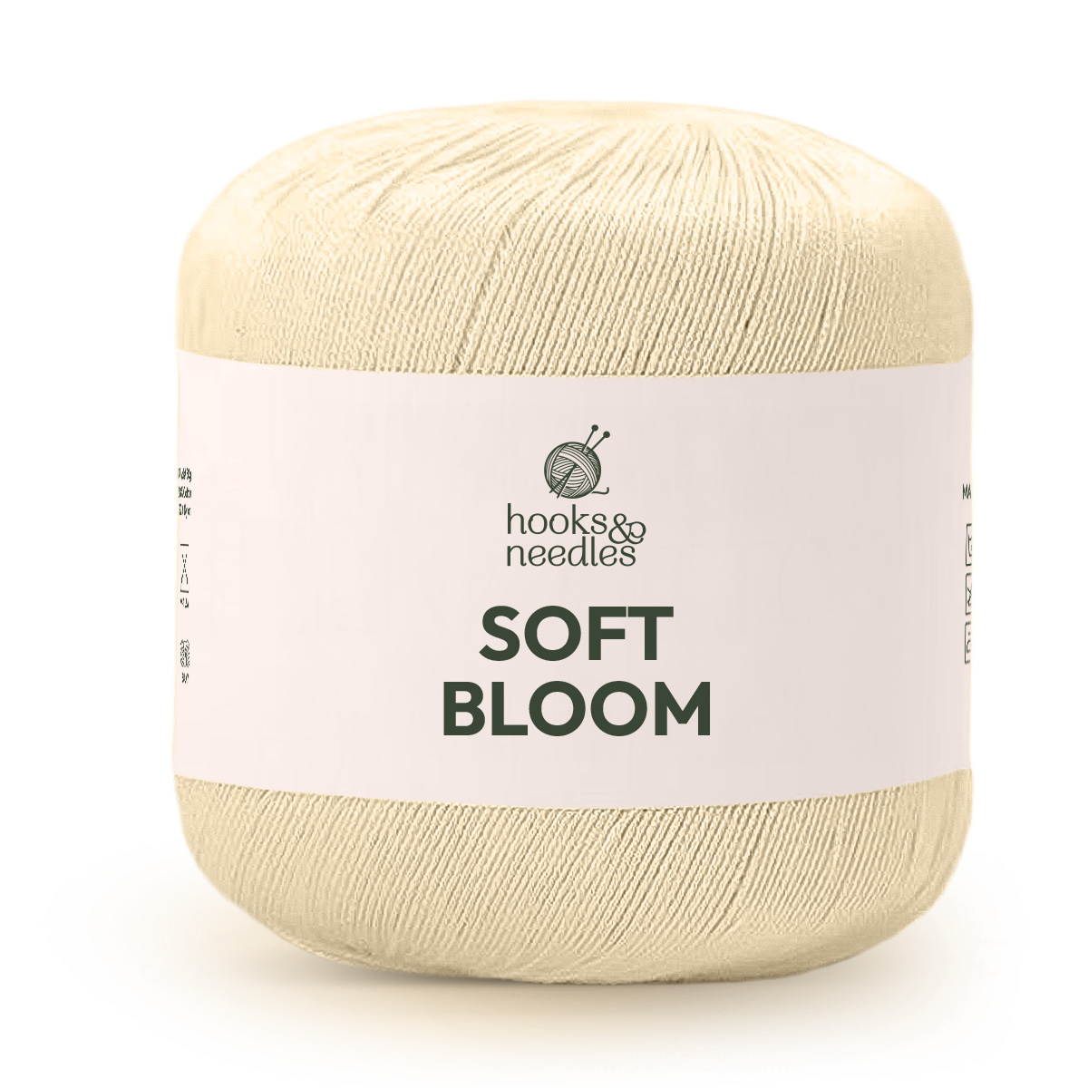 A cream-colored ball of Soft Bloom Yarn, made from cotton silk and labeled with a simple crossed knitting needles and yarn logo.