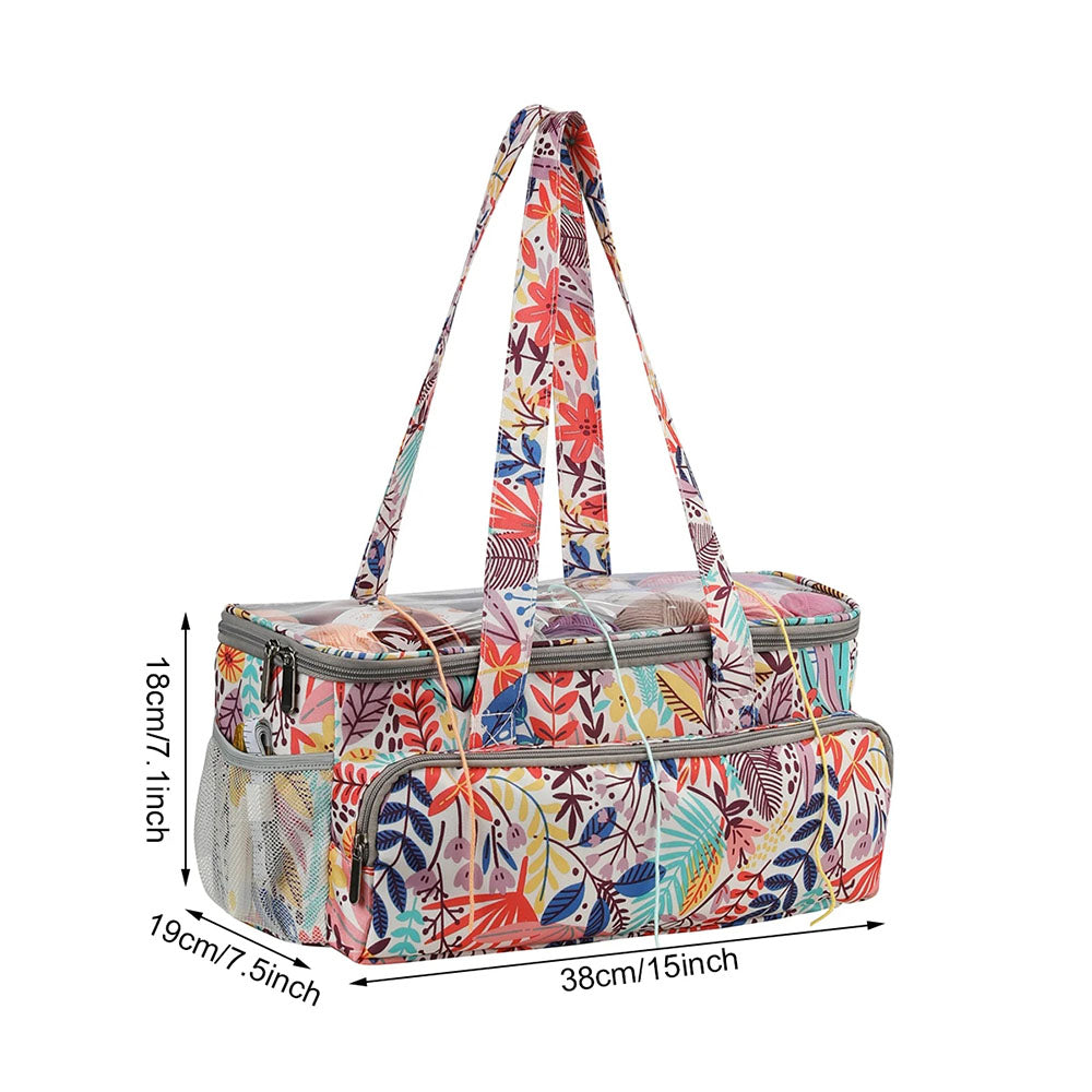 The Knitting Bag: Yarn Organizer, adorned with vibrant floral patterns, features a spacious main compartment and a front pocket. Ideal for storing knitting accessories, it includes two sturdy handles and measures 15 inches in length, 7.5 inches in width, and 7.1 inches in height.