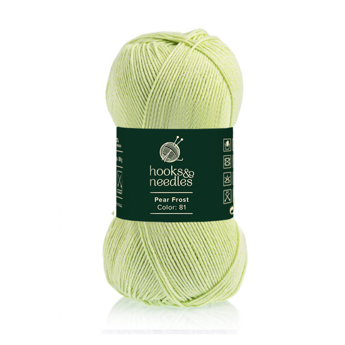 A skein of Pear Frost super bulky yarn in light green (Color: 81) with care symbols on a dark green band—ideal for making cozy winter garments.