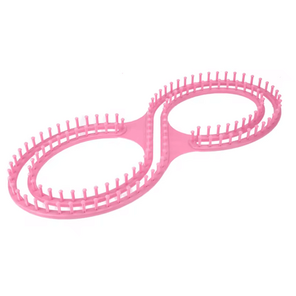 The Knitting Loom for Blankets and Scarves is a beginner-friendly pink plastic tool with two connected oval rings, each lined with evenly spaced pegs—ideal for creating cozy blankets.