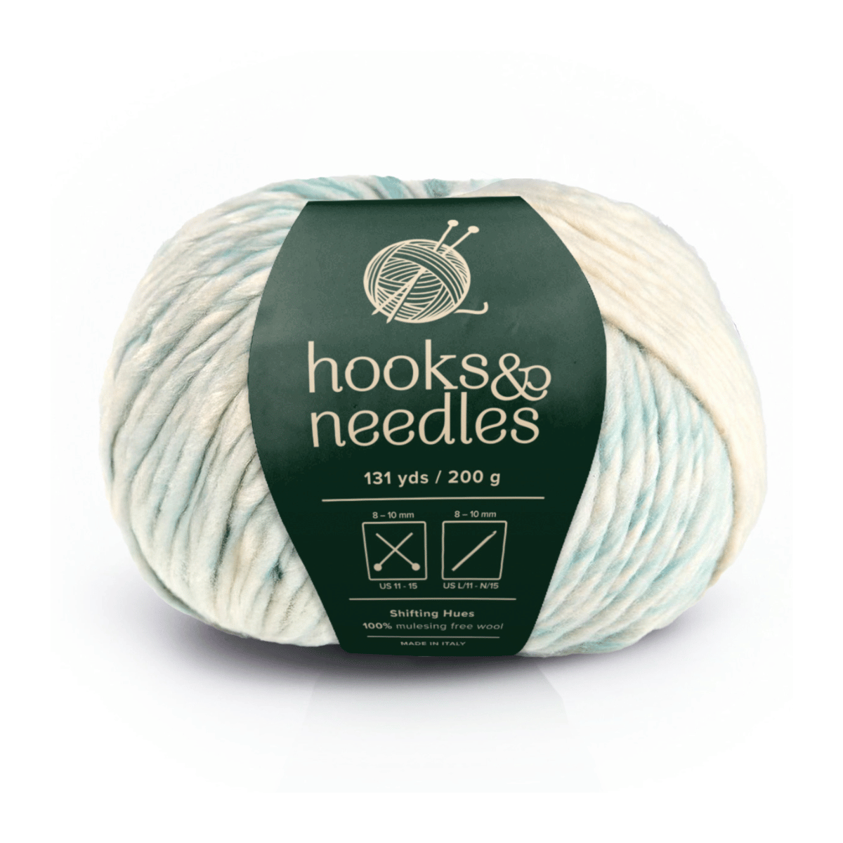 Shifting Hues: A 200g skein of bulky cream and pale blue yarn (131 yds), made from 100% mulesing-free wool with a green "hooks & needles" label—ideal for projects needing luxurious warmth.