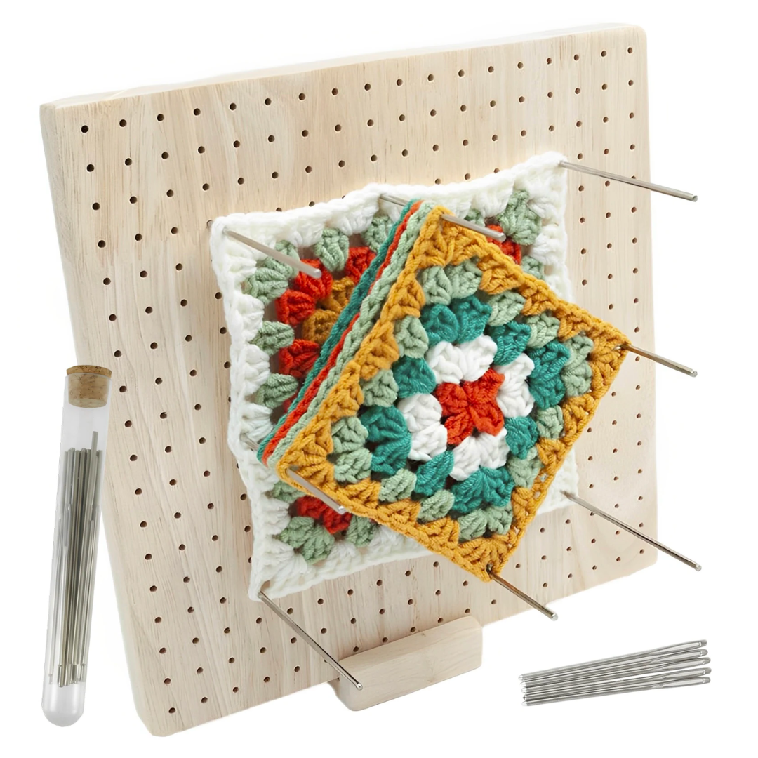 Crochet Blocking Board being used to block a crocheted square on a precise grid with stainless steel pins.
