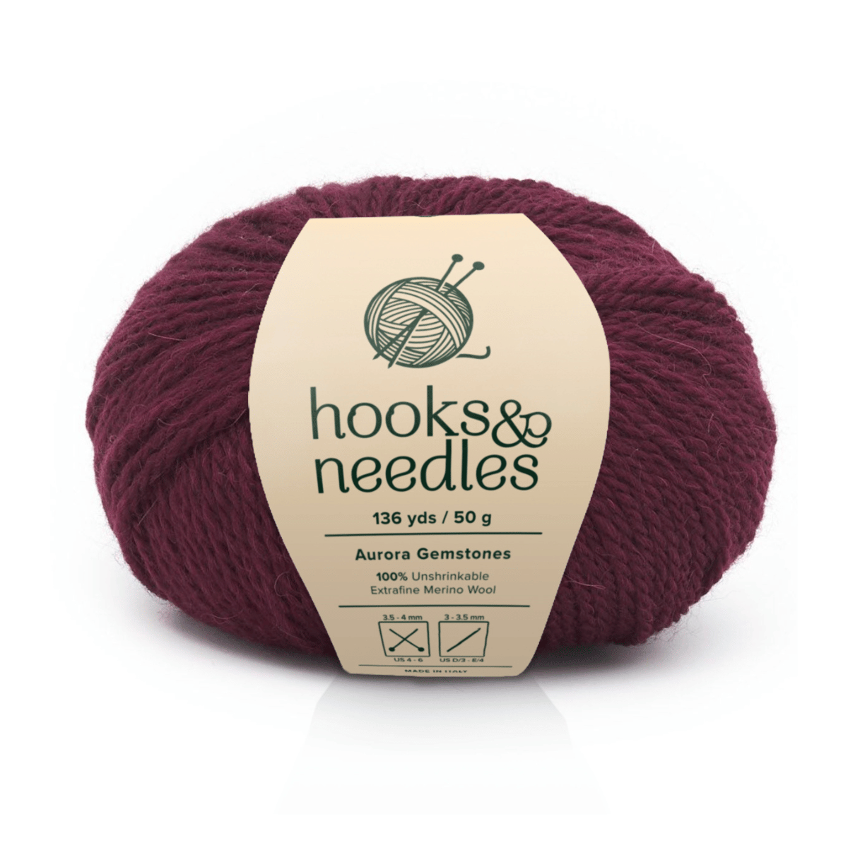 A 136 yd/50 g ball of "hooks & needles" Aurora Gemstones Pear Frost Yarn, dark burgundy, 100% extrafine merino wool. Ideal for lightweight projects. Care instructions included.