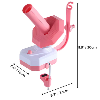 The Electric Yarn Winder, in pink and white with a cylindrical tube, control knob, and measurements of 11.8" x 8.7" x 5.5", is a portable device that makes winding yarn easy for any crafting space.