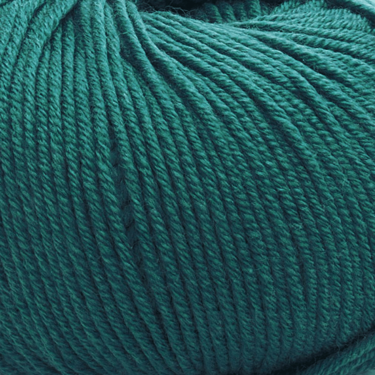 Close-up of a ball of Vintage Garden yarn in teal, showing its medium weight, texture, and tightly wound strands.