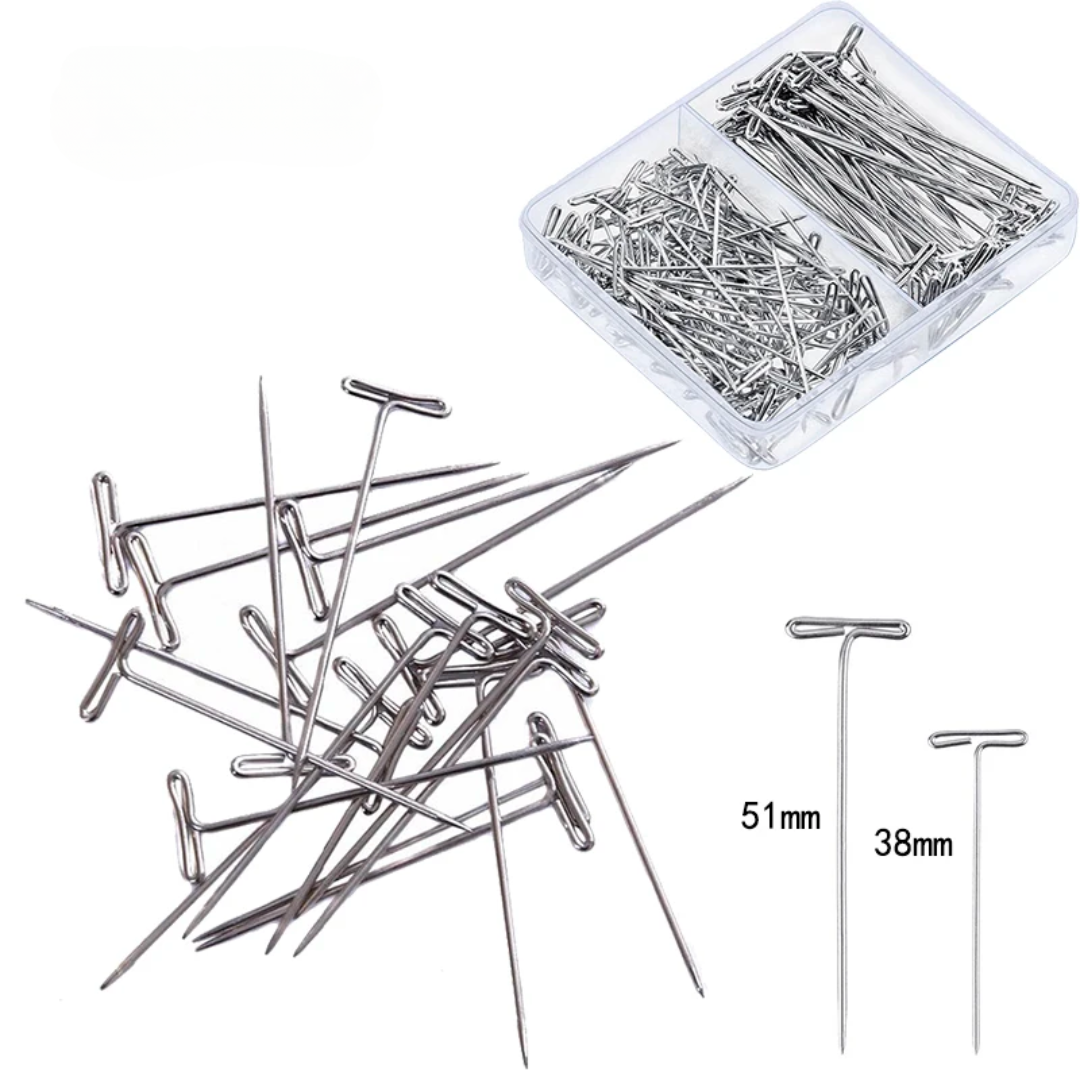 A box of T-Pins For Blocking featuring durable, rust-resistant pins in various sizes, with a few scattered outside.