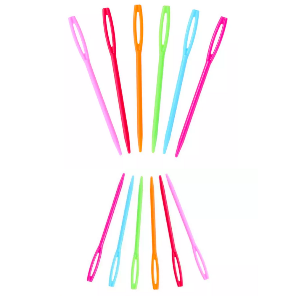 Twenty plastic yarn needles in a range of colors are creatively displayed in a radial pattern on a white background, ideal for knitting and crocheting enthusiasts.
