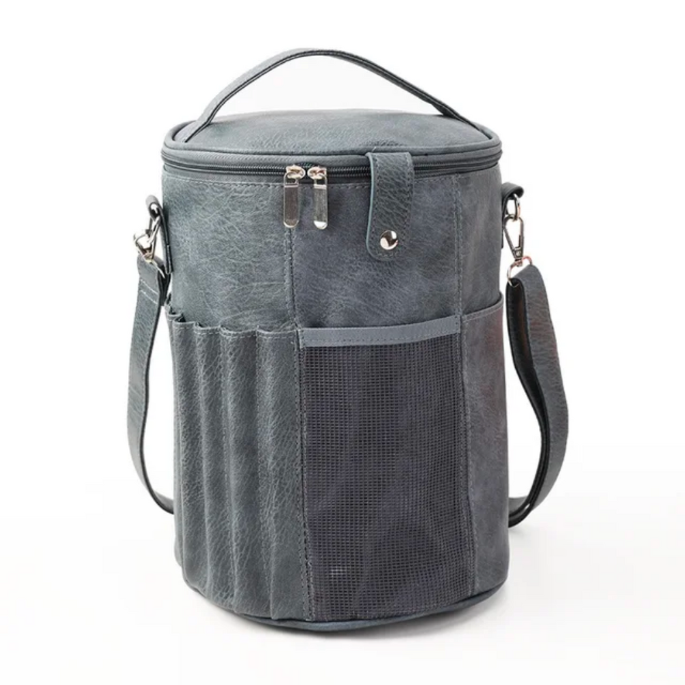 PU Leather Knitting Crochet Tools Storage Bag in gray features a cylindrical shape, top handle, and detachable strap. It includes side pockets and a zippered top, making it ideal for organizing crochet tools.