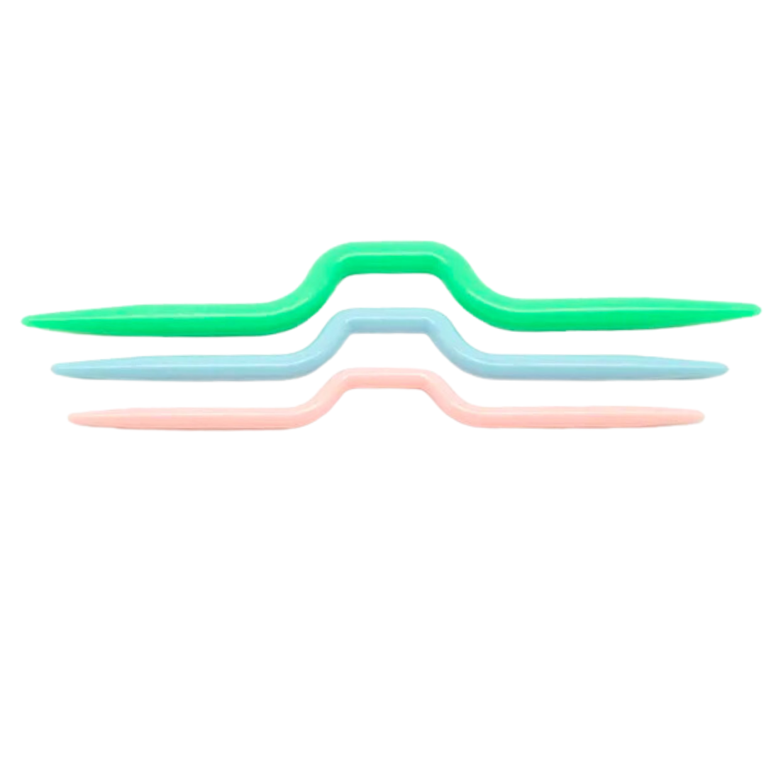 Three vibrant Plastic Cable Needles, crafted from high-quality plastic in green, blue, and pink, are aligned in parallel—an essential addition to any knitting toolkit.