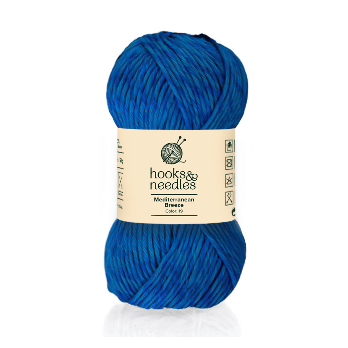 A skein of Mediterranean Breeze, Color 19, is a bulky blue cotton-viscose blend yarn. Care instructions can be found on the "hooks & needles" packaging.