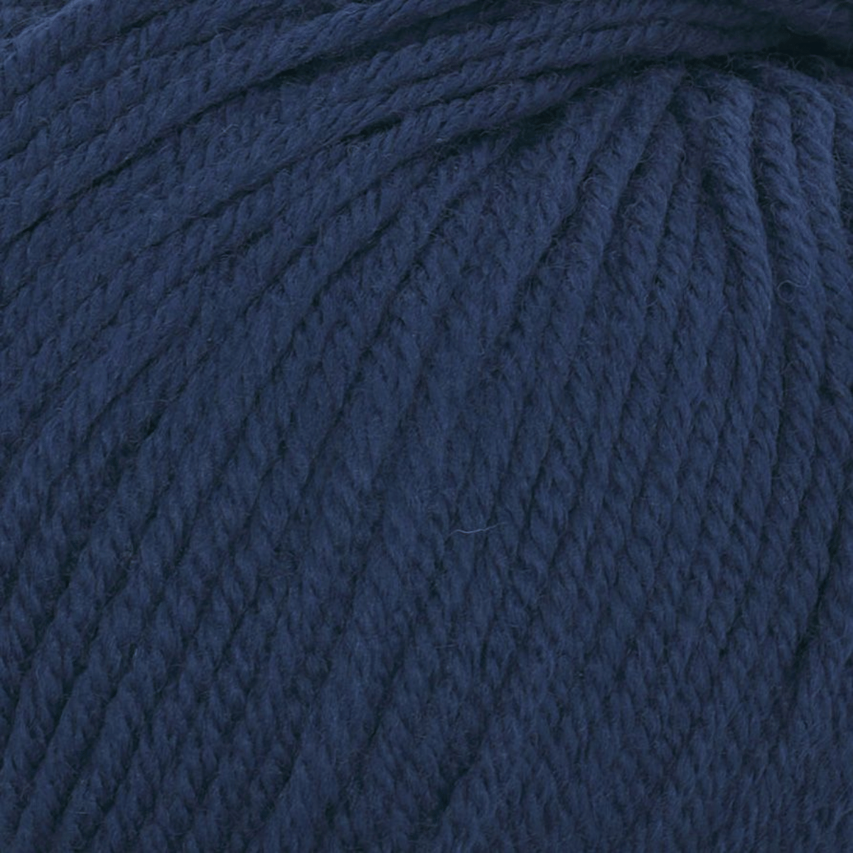 Close-up view of Cozy Wool in dark blue, highlighting its soft, breathable texture and beautifully twisted strands.