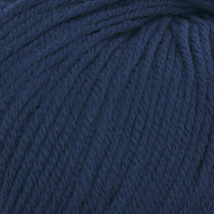 Close-up view of Cozy Wool in dark blue, highlighting its soft, breathable texture and beautifully twisted strands.
