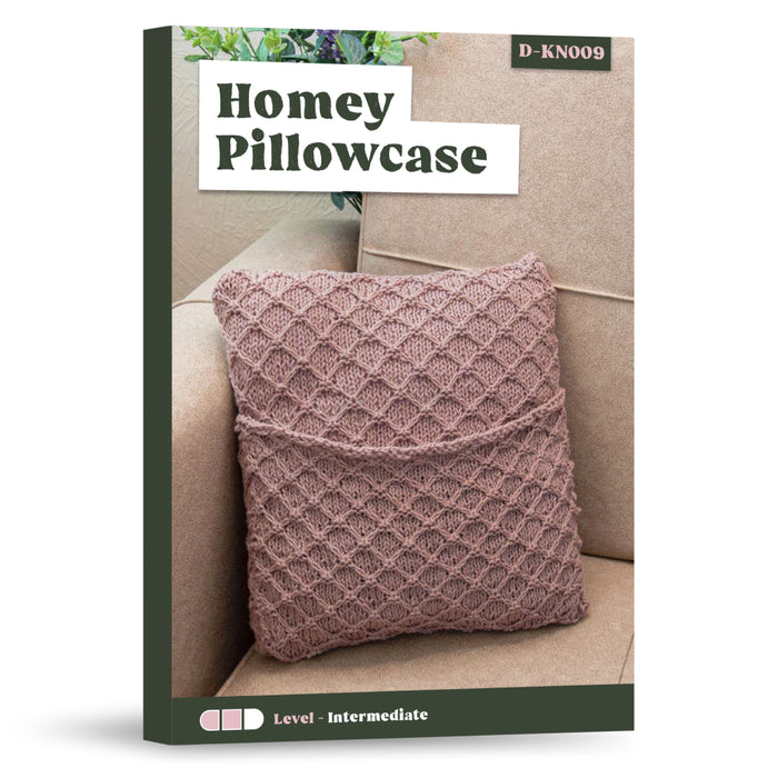 A pink, textured stitch pillowcase is featured on a beige couch on the cover of the "Homey Pillowcase Knitting Pattern" book.