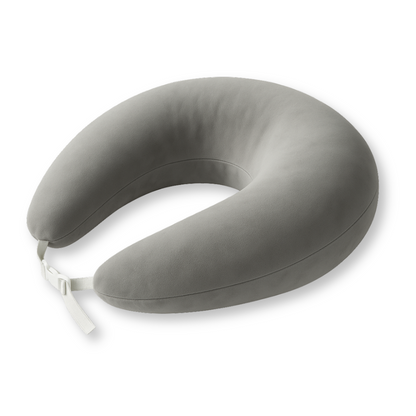 The Crochet & Knit Support Pillow is a gray U-shaped travel neck pillow with a white adjustable strap, designed for comfort and to ease tension during long trips. Shown on a white background.