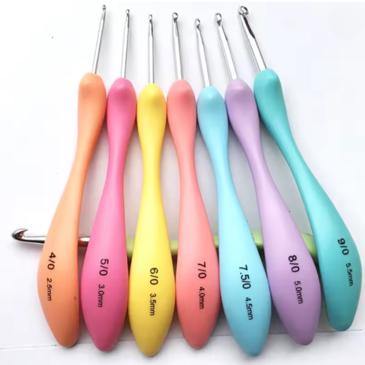 The Crochet Hook Set 8 Pcs with Soft Grip Handles includes eight colorful hooks, each labeled from 2.5 mm to 5.5 mm, and arranged in a row for easy size selection.