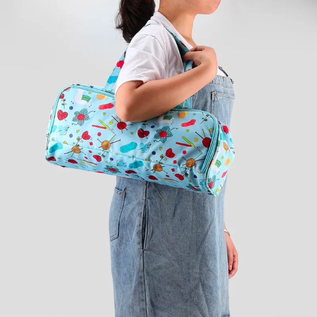 Woman holding a Knitting Crocheting Bag Yarn Storage over her shoulder against a grey background.