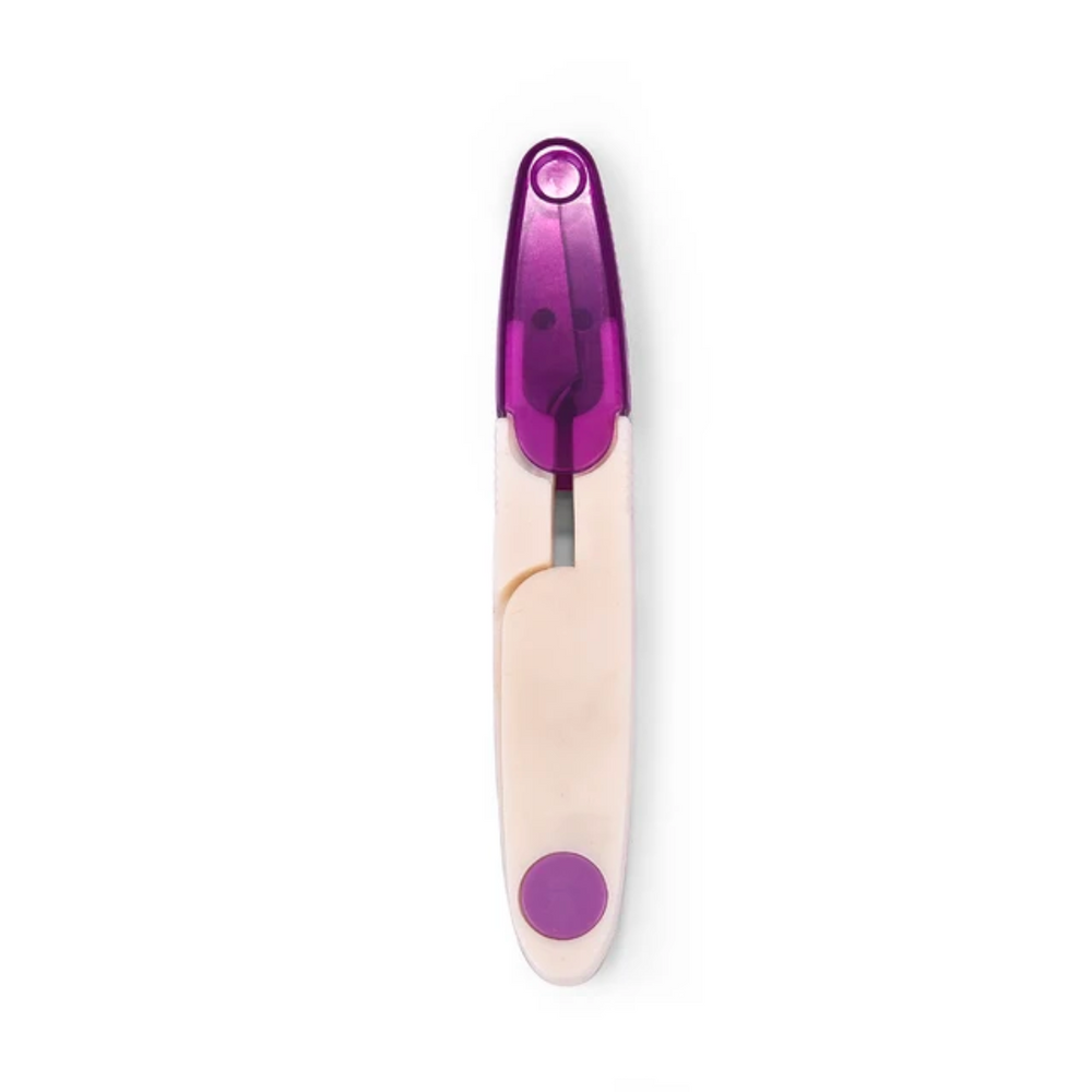 A plastic yarn thread snips with a purple ignition mechanism and precision cuts, isolated on a white background.
