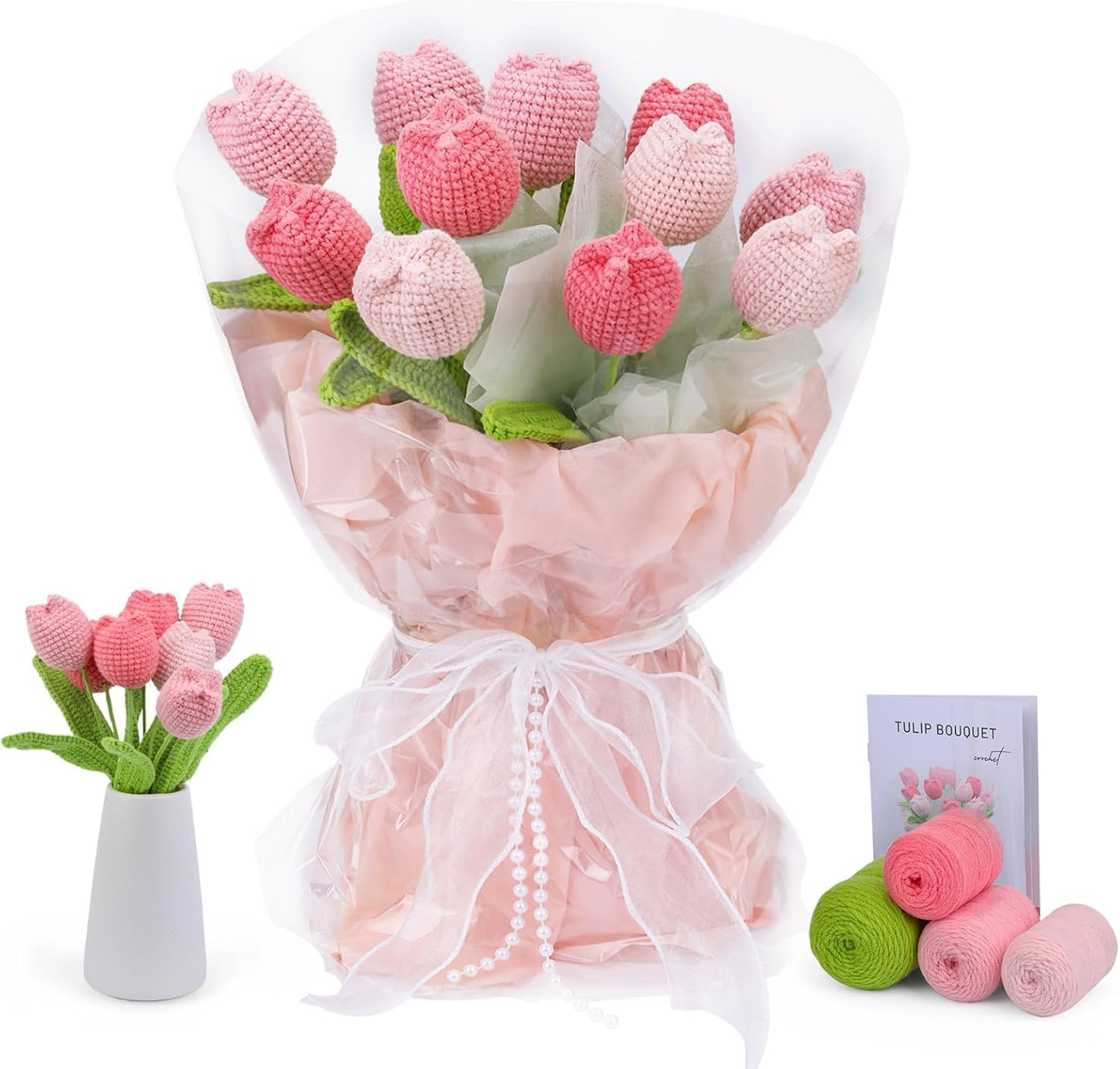 The Crochet Tulip Bouquet Kit features pink and light pink crocheted tulips, tissue and cellophane wrap, yarn, a vase display, and a "Tulip Bouquet" booklet—making it the perfect crochet gift.