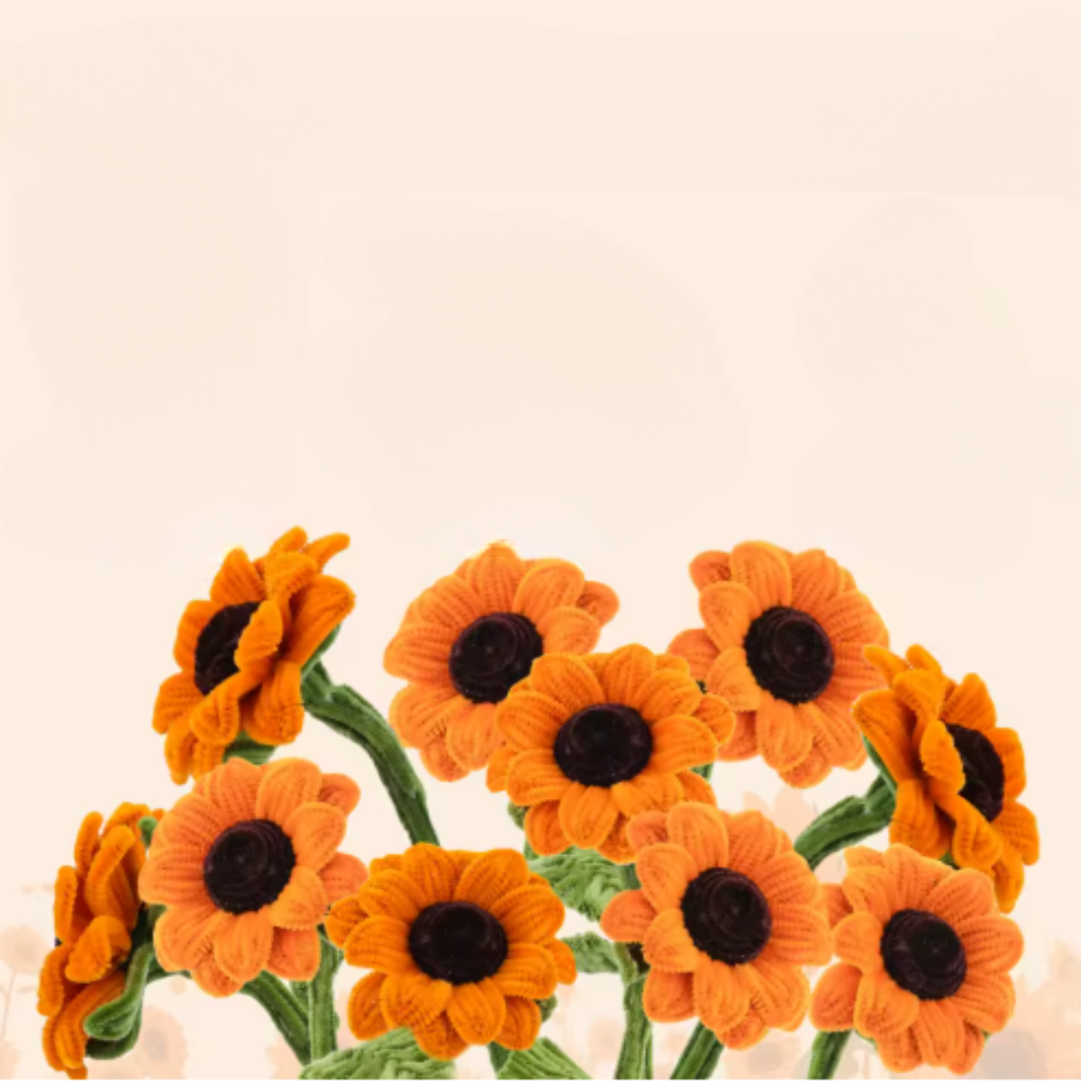 The Sunflower Crochet Kit includes materials to create orange sunflowers with green stems, perfect for arranging a sunflower bouquet against a neutral background.
