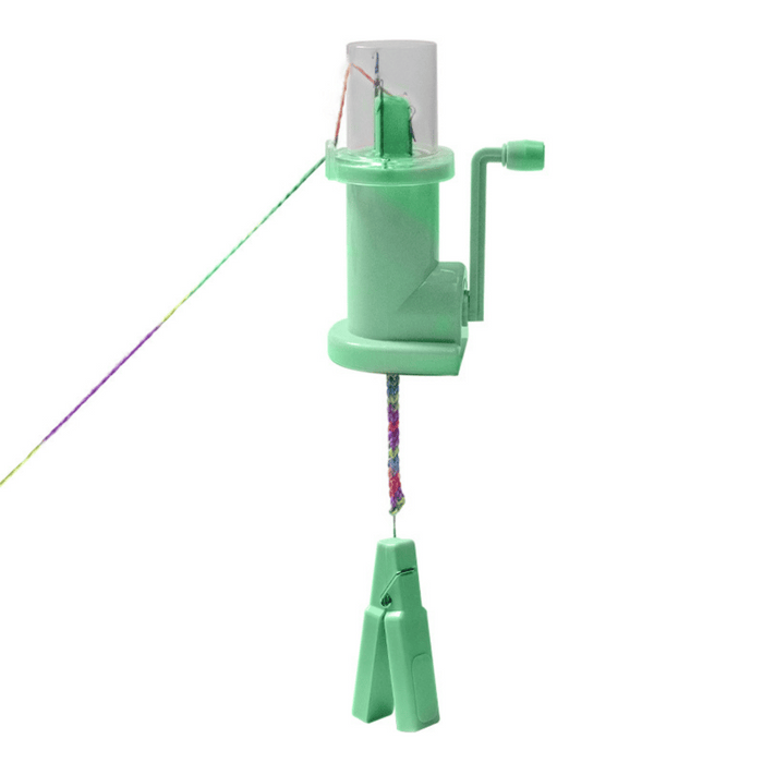 The i-Cord Knitting Machine is a green handheld device with a crank handle and multicolored yarn, creating braided cords with two green clips—ideal for easy I-cord making.