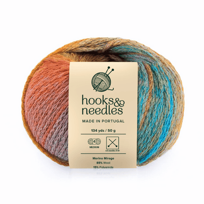 Merino Mirage is a multicolored, medium weight luxury yarn (134 yds/50g), made in Portugal with 85% Merino wool and 15% polyamide; labeled "hooks & needles" with care symbols.