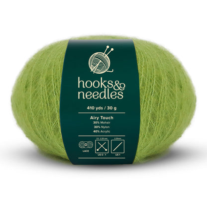 Introducing the Airy Touch Yarn 30g in a soothing green shade, labeled "hooks & needles," offering an impressive 410 yards. This lace-weight yarn is crafted from a blend of 30% Mohair, 30% Nylon, and 40% Acrylic, making it ideal for creating ethereal garments or delicate accessories. For best results, use needle sizes ranging from 1.5mm to 2.25mm.