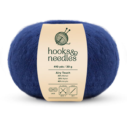 The Airy Touch Yarn 30g is a ball of blue yarn featuring 410 yards of lace-weight fibers made from 30% mohair, 30% nylon, and 40% acrylic, making it perfect for creating delicate accessories and ethereal garments.