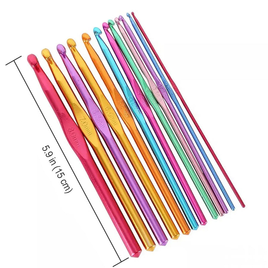 A set of Aluminum Crochet Hooks 12 Pcs of varying sizes arranged in a row next to a ruler showing their length as 5.9 inches (15 cm), perfect for intricate projects.