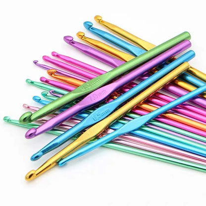 A variety of colorful Aluminum Crochet Hooks 12 Pcs arranged on a white background, with sizes ranging from 2.0 mm to 6.5 mm, perfect for intricate projects.