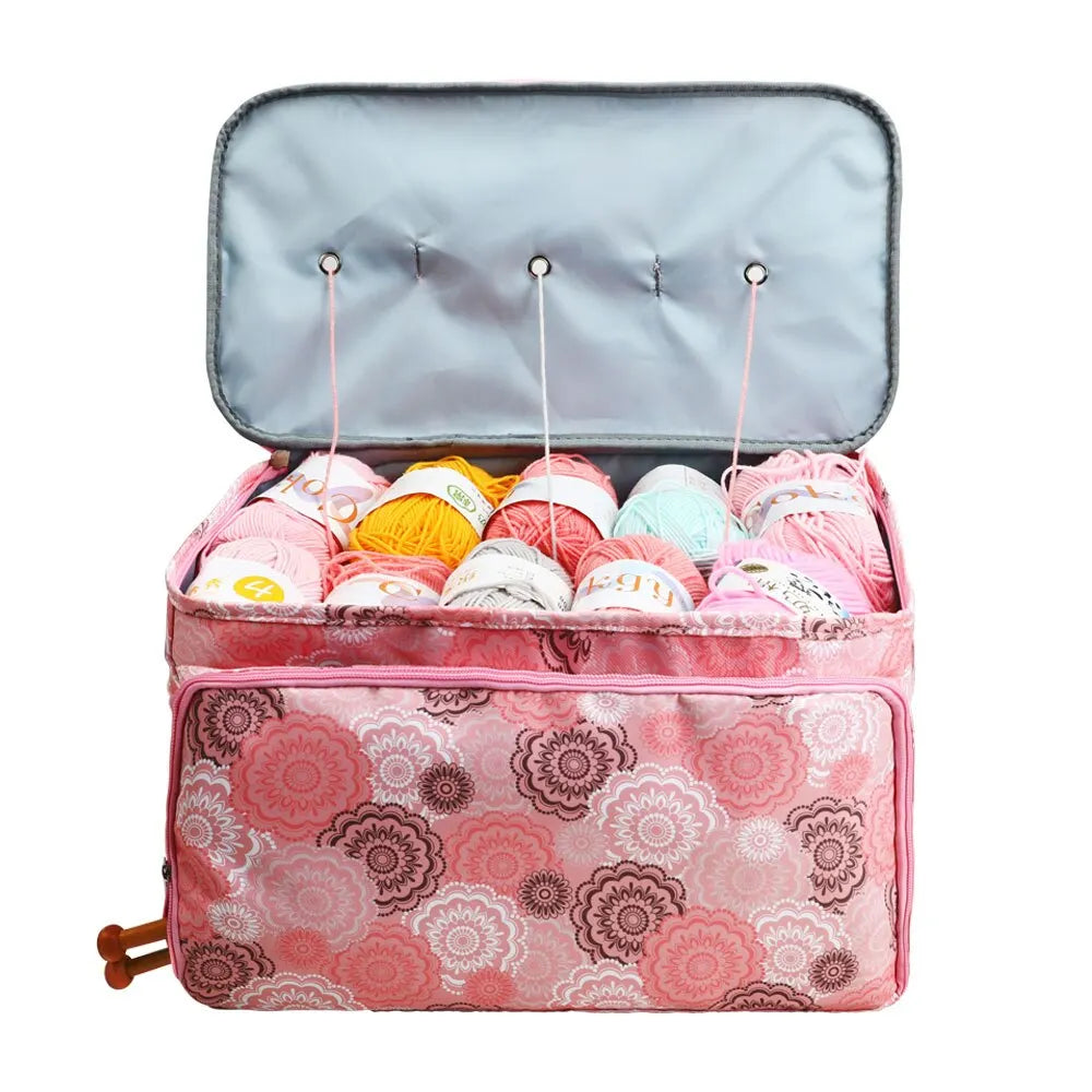 A Multi-Purpose Craft Bag with an ornate pattern opened to reveal an assortment of colorful yarn balls inside.