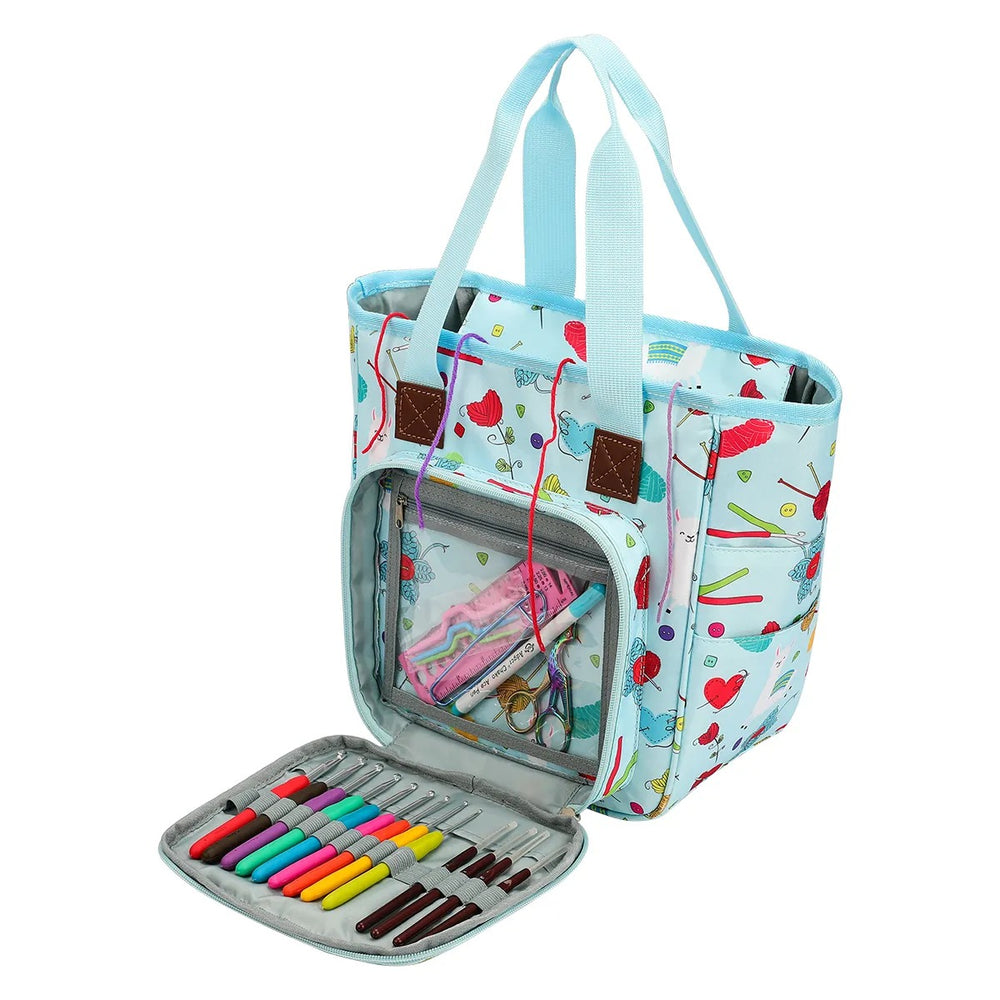 Blue Yarn Organizer Tote with handles, featuring a sewing tools pattern. The open front compartment showcases colorful markers and washi tape, making it perfect for all your crocheting and knitting essentials.